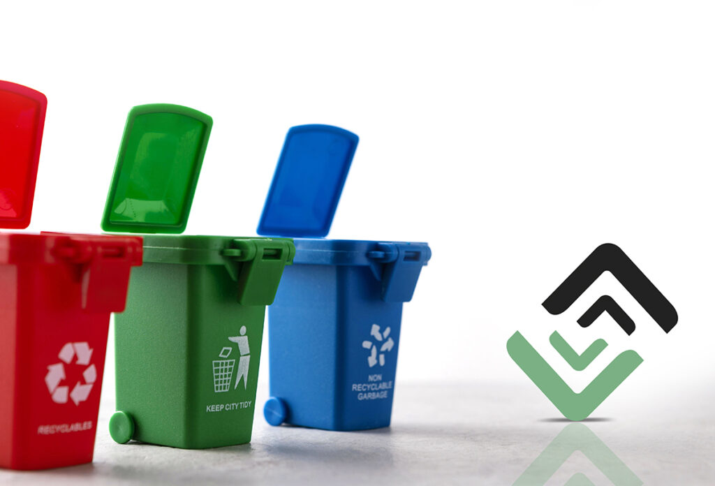 three miniature recycle bins